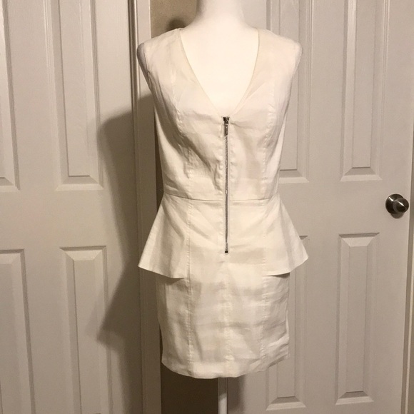 bebe Dresses & Skirts - BEBE Sleeveless White Peplum Dress